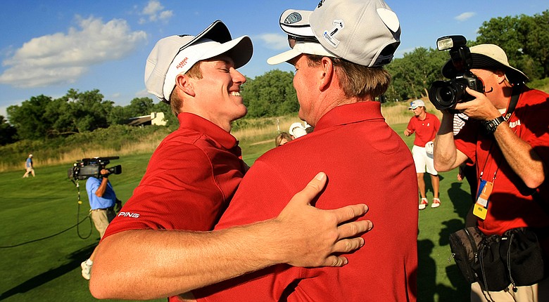 Alabama head coach Jay Seawell (right) congratulates freshman Robby Shelton after the Crimson Tide defeated Oklahoma State on Wednesday in the NCAA Men's Division I Championship at Prairie Dunes in Hutchinson, Kan.
