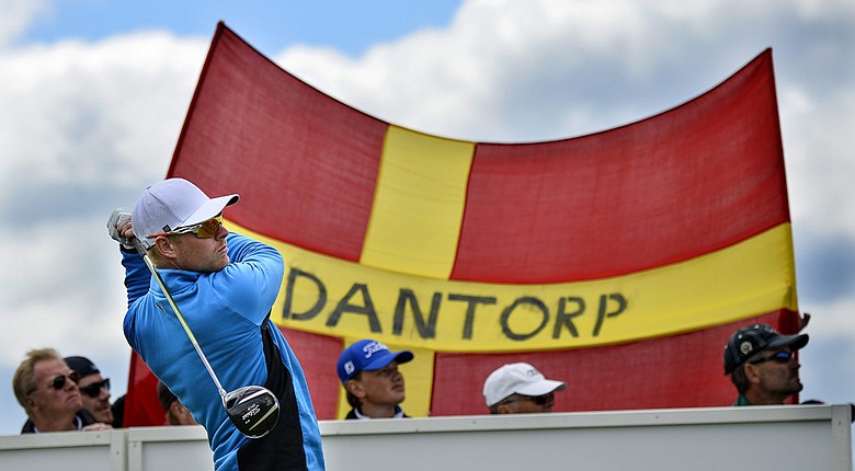 Sweden's Jens Dantorp watches the flight of his ball in front of a flag with his name on it during the first day of the Nordea Masters.