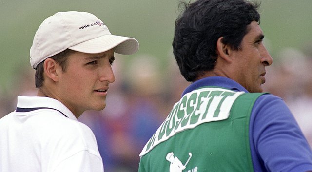 David Gossett listens to his caddie, Andy Martinez, during the 1999 U.S. Amateur at Pebble Beach.