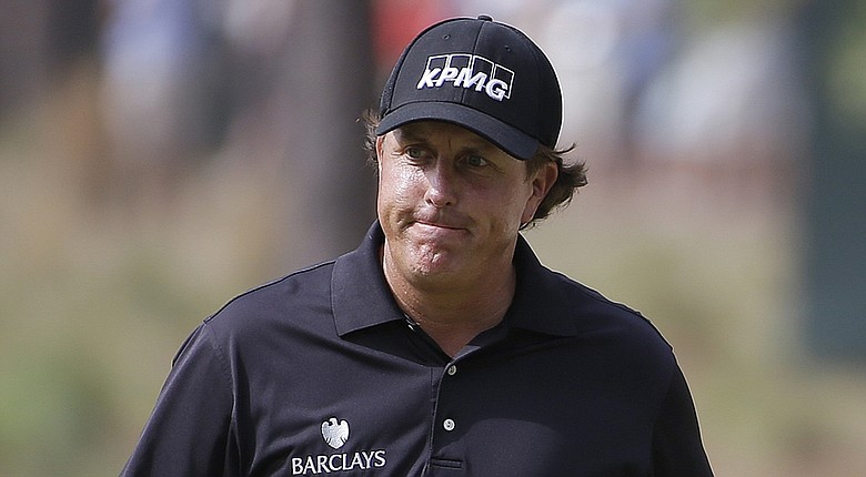 Phil Mickelson, shown during the first round of the 2014 U.S. Open at Pinehurst, reportedly won't be charged in regard to an investigation of Clorox shares trading, but remains linked to the federal probe.