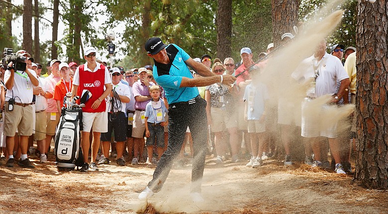 Dustin Johnson hits a shot from the natural habitat on the eighth hole during the first round of the U.S. Open at Pinehurst No. 2.