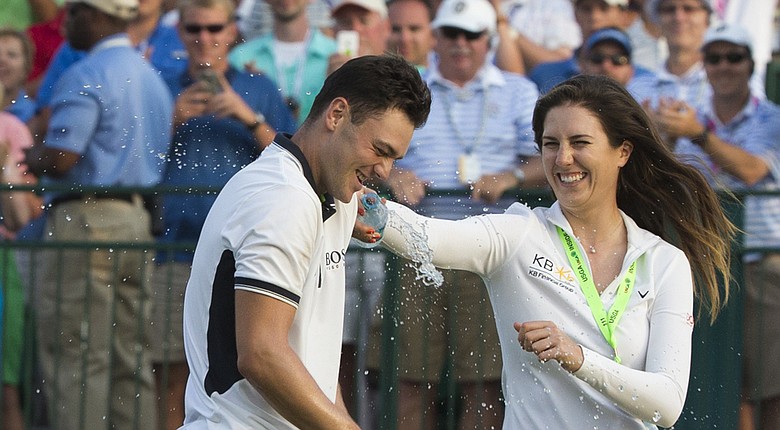 Martin Kaymer celebrates his U.S. Open win with German compatriot Sandra Gal on the 18th green at Pinehurst No. 2.