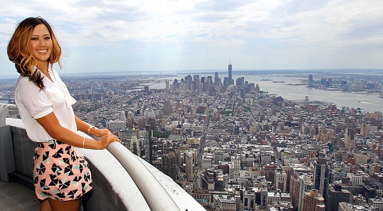 Michelle Wie, winner of the U.S. Women's Open, poses for a photo on the 103rd floor of the Empire State Building during her media tour Tuesday in New York City.