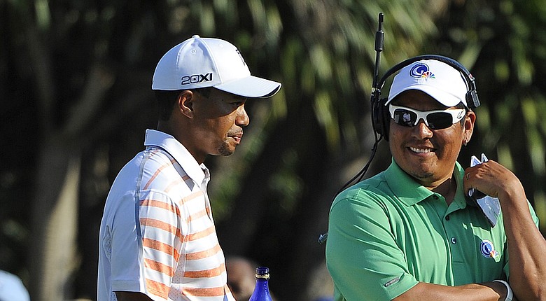 Tiger Woods will play in a tournament that benefits the charitable foundation of former Stanford teammate Notah Begay III between two 2014 FedEx Cup playoff events (Woods and Begay shown here last year at Doral).