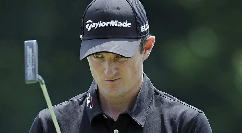 Justin Rose looks over his birdie putt on the ninth hole during the second round of the WGC-Bridgestone Invitational.