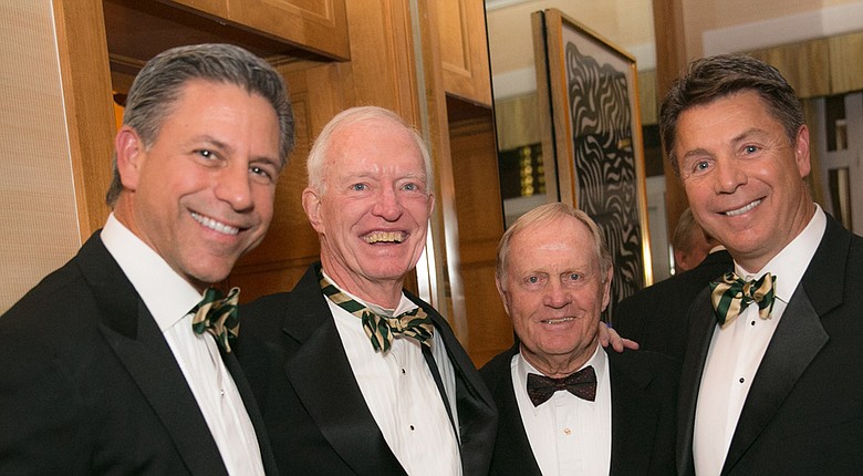 Evans Scholars Foundation senior vice president of foundation advancement Jim Moore, second from left, with Jack Nicklaus and Evans scholars George (left) and Geoff Solich.