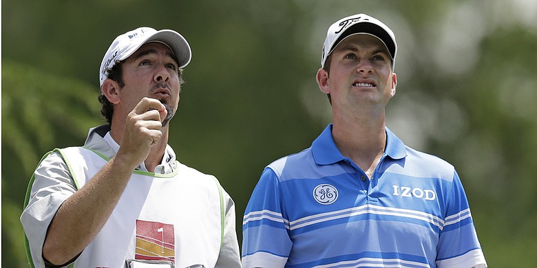 Paul Tesori, left, with his player Webb Simpson is among the caddies involved in a lawsuit with the PGA Tour.
