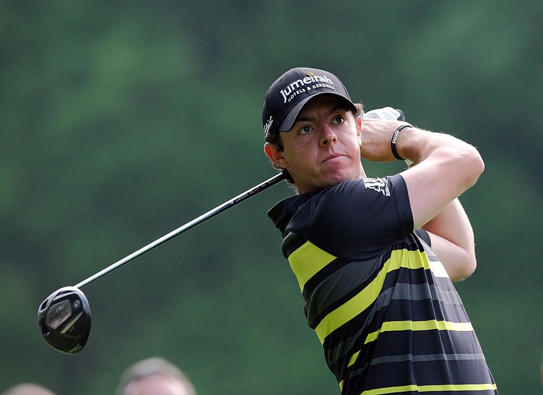Northern Ireland's Rory McIlroy watches his shot on the 3rd hole during day one of the BMW PGA Championship.