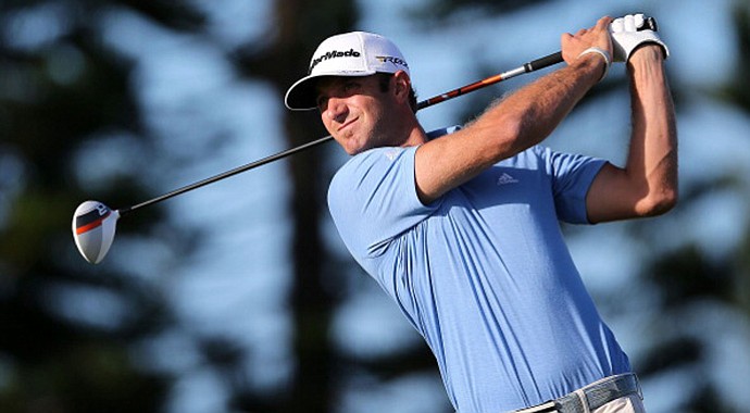 Dustin Johnson hits a tee shot on third hole during the final round of the Hyundai Tournament of Champions.