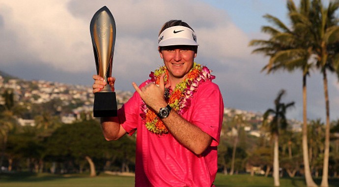 Rookie Russell Henley poses with the Sony Open trophy.