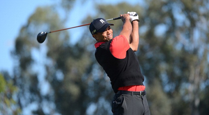 Tiger Woods hits off the 9th tee during the final round at the Farmers Insurance Open at Torrey Pines.