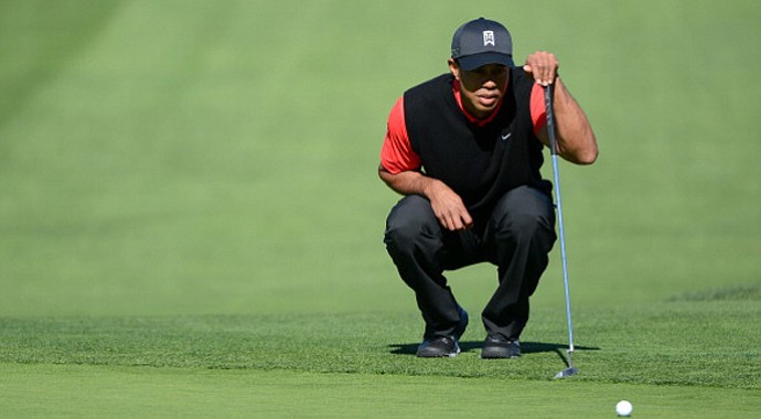 Tiger Woods studies the 9th green during the final round at the Farmers Insurance Open at Torrey Pines Golf Course.