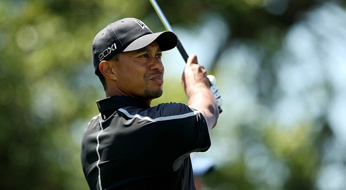 Tiger Woods watches his tee shot at No. 7 in Round 1 of the Arnold Palmer Invitational.