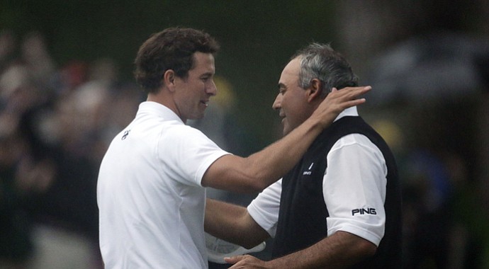 Adam Scott and Angel Cabrera hug at the conclusion of Scott's playoff win in the 2013 Masters.