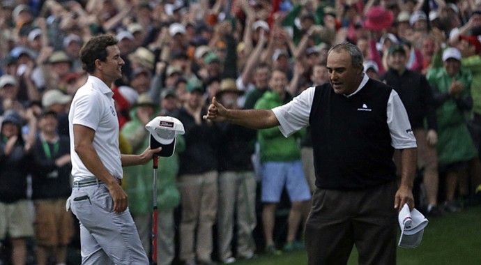 Adam Scott receives a thumbs-up from Angel Cabrera after sinking a birdie putt to win the 2013 Masters.