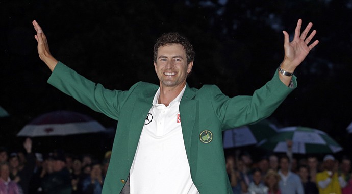 Adam Scott wears the green jacket after his 2013 Masters win in a playoff.