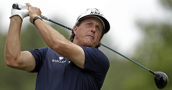 Phil Mickelson watches his tee shot on the fourth hole during the second round of the Wells Fargo Championship at Quail Hollow Club.