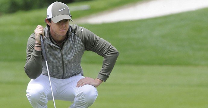 Rory McIlroy lines up a putt on the first hole during the third round of the Wells Fargo Championship at Quail Hollow Club.