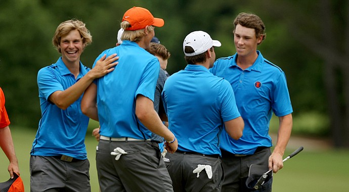 Thomas Pieters of Illinois is congratulated by his teammates after they defeated Cal to advance to the finals during the semifinals of match play at the 2013 NCAA Championship.
