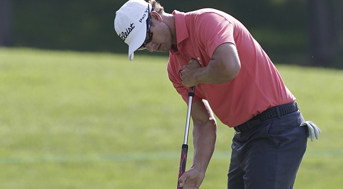 Adam Scott putts during the 2013 Memorial at Muirfield Village in Dublin, Ohio