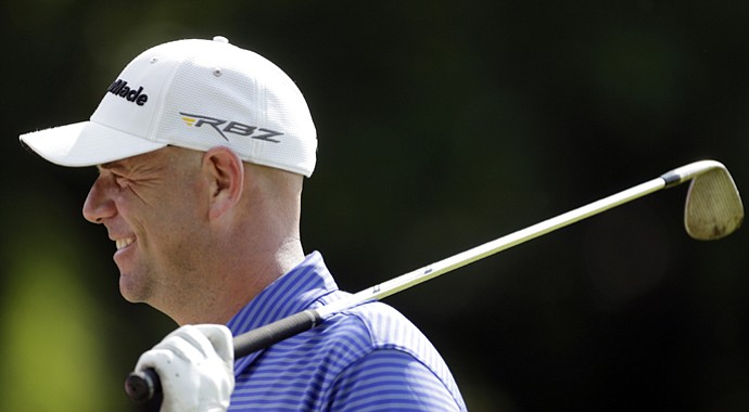 Mud on his clubface at Merion Golf Club, Stewart Cink practices Tuesday for the 2013 U.S. Open.