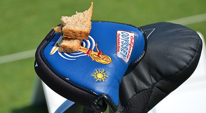 Luke List used his bikini-clad Odyssey putter headcover as a sandwich plate while practicing on the range at Congressional for the 2013 AT&T National.