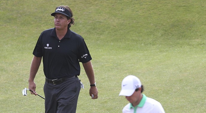 Phil Mickelson (left) and Rory McIlroy during the first round of the 2013 British Open at Muirfield.