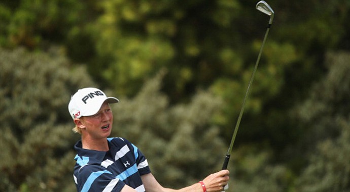 Amateur Jimmy Mullen hits his tee shot on the third hole during the first round of the Open Championship at Muirfield.
