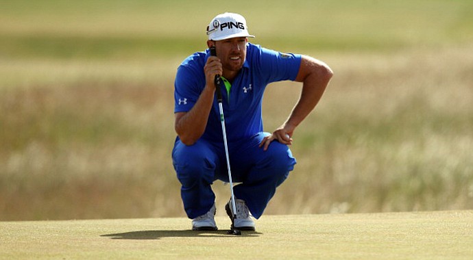 Hunter Mahan lines up a putt on the 13th green during the third round of the 2013 Open Championship at Muirfield in Gullane, Scotland