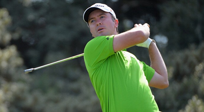 Martin Laird hits his tee shot on the third hole during the third round of the Open Championship at Muirfield.