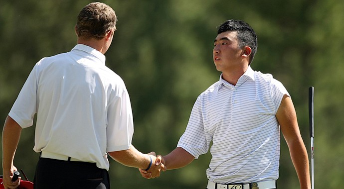 Adam Wood concedes the 17th hole and the match to Doug Ghim during the Round of 64 at the 66th U.S. Junior Amateur Championship.