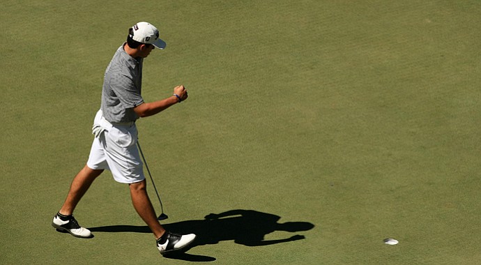 Davis Riley pumps his fist after making birdie to keep his 1-up lead over Scottie Scheffler during the first 18-holes of the finals of the 66th U. S. Junior Amateur Championship.