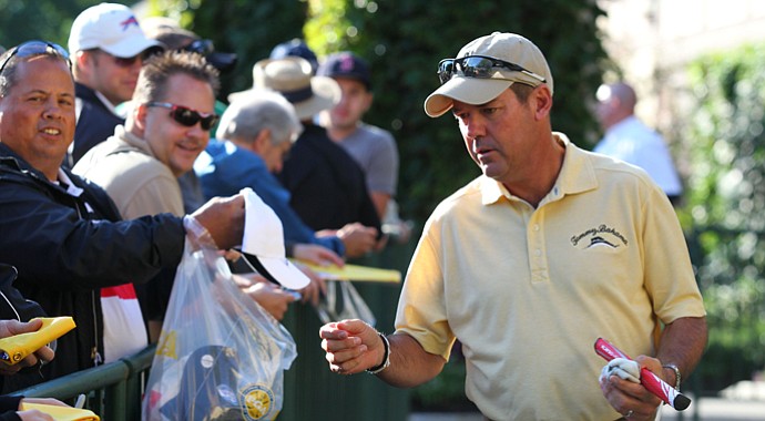 Rich Beem signs autographs during early-week preparation for the 2013 PGA Championship at Oak Hill.