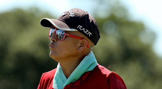 Delin Feng caddied for daughter Yueer "Cindy" Feng during her 2-and-1 loss to Emma Talley in the 2013 U.S. Women's Amateur final.