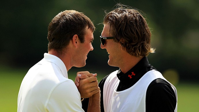 Corey Conners celebrates with his caddie Garrett Rank after they defeated Neil Raymond during the quarterfinals at the 2013 U. S. Amateur at The Country Club.