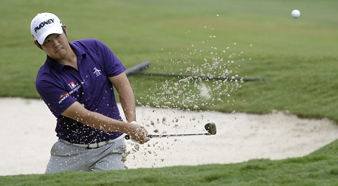 John Huh hits out of a bunker on No. 18 during the third round of the Wyndham Championship at Sedgefield Country Club in Greensboro, N.C.