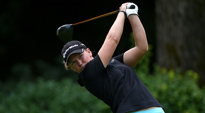 Austin Ernst tees off on the 18th hole of the Safeway Classic at Columbia Edgewater Country Club in Portland, Ore.