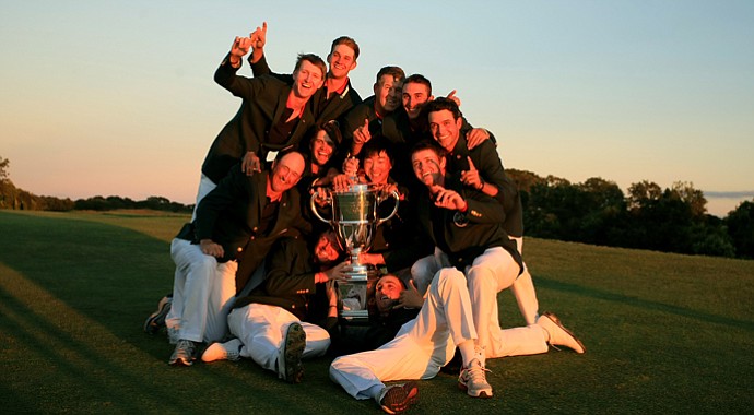 Team USA has a little fun with the trophy after defeating GB&I 17-9 at the 2013 Walker Cup in Southampton, N.Y.