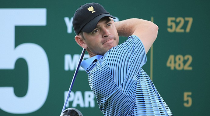 Louis Oosthuizen of South Africa and the International Team watches a shot during a practice round prior to the start of The Presidents Cup at the Muirfield Village Golf Club.