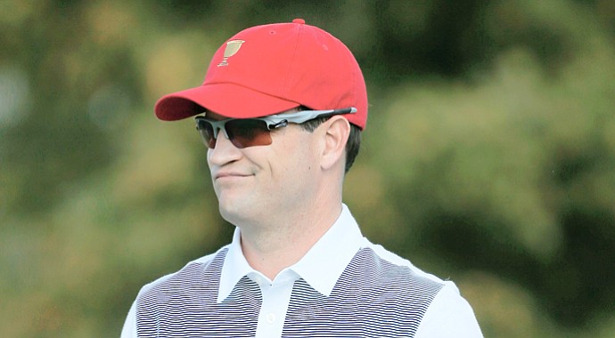 Team USA's Zach Johnson waits on the range during a practice round prior to the start of The Presidents Cup.