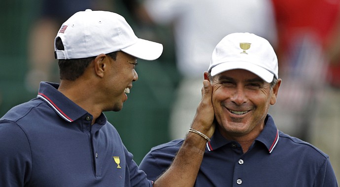 Tiger Woods jokes with Fred Couples during the 2013 Presidents Cup at Muirfield Village.