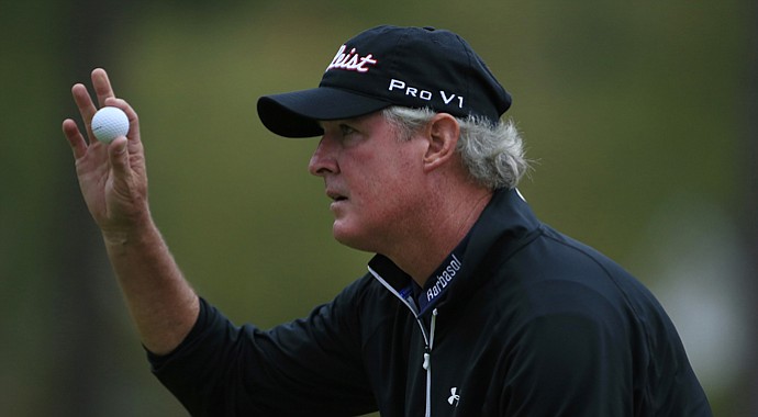 Russ Cochran acknowledges the gallery on the 18th green during the second round of the SAS Championship.