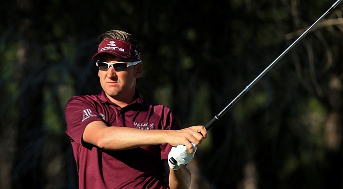 Ian Poulter plays his tee shot on the par-3 14th during the third round of the Turkish Airlines Open.