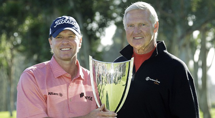 Jerry West, right, with Steve Stricker after Stricker's victory at the 2010 Northern Trust Open. West is stepping down as the tournament's executive director.