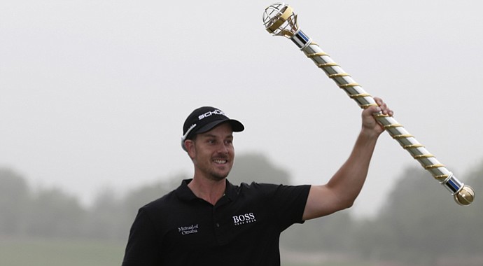 Henrik Stenson celebrates his DP World Tour Championship victory, which gives him the European Tour's 2013 Race to Dubai title to go with his 2013 FedEx Cup title on PGA Tour.