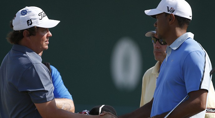 Jason Dufner and Tiger Woods shake hands during the 2013 Open Championship.