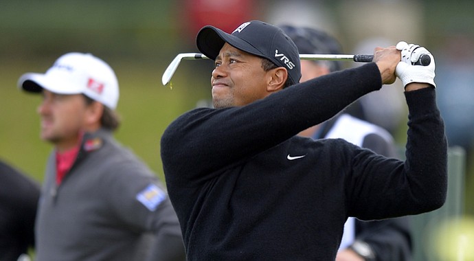 Tiger Woods and playing competitor Graeme McDowell during Friday's second round of the Northwestern Mutual World Challenge.