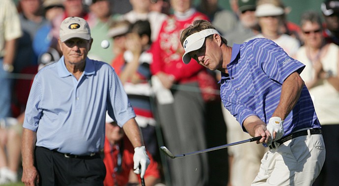 Jack Nicklaus II chips as his father watches during the Father/Son Challenge in 2008.