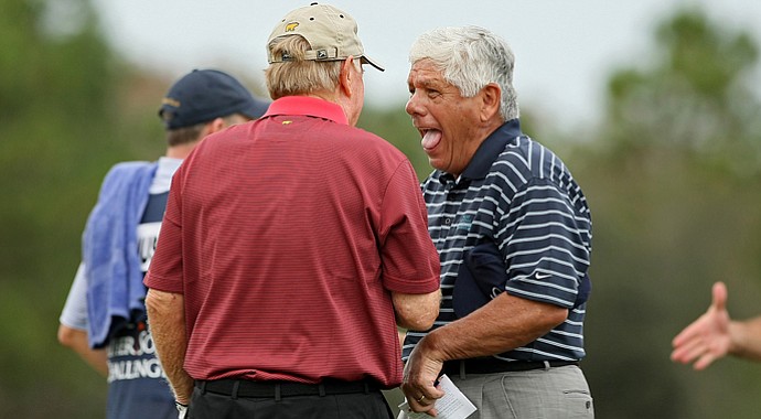 Lee Trevino jokes with Jack Nicklaus on No. 18 during Saturday's round at the PNC Father/Son Challenge at The Ritz Carlton Golf Club of Orlando.