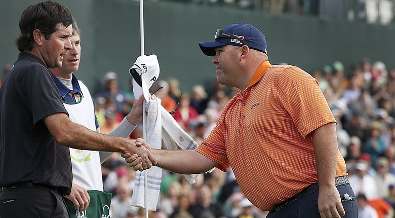 Kevin Stadler shakes hands after winning the 2014 Phoenix Open by a shot over Bubba Watson (left) and Graham DeLaet for his first PGA Tour win.